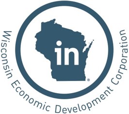 The logo for the Wisconsin Economic Development Corporation. A blue circle with a silhouette of Wisconsin inside. The letters "in" appear in white over the silhouette of wisconsin. 