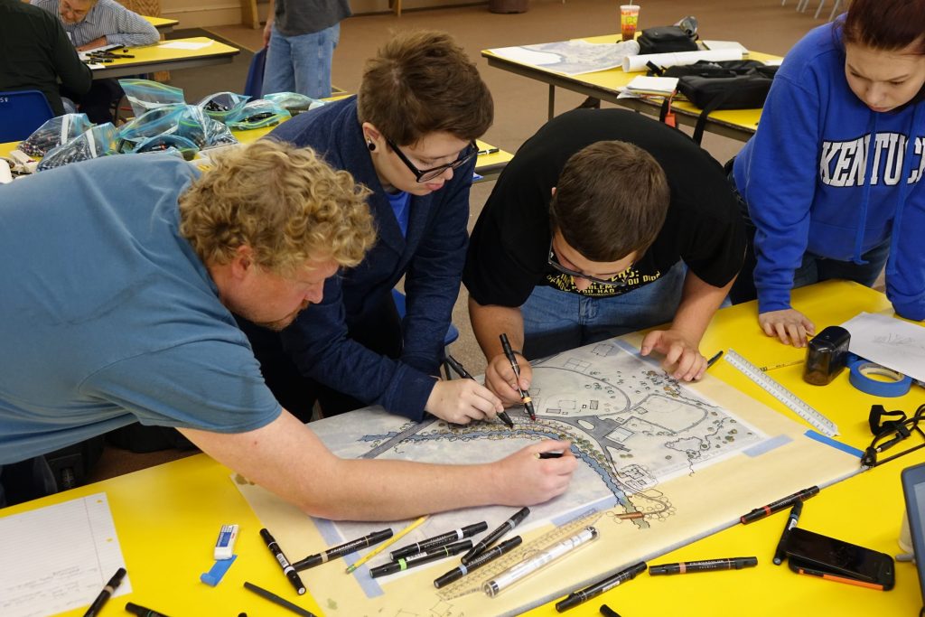 A group gathers to explore design choices for Iron County Trail