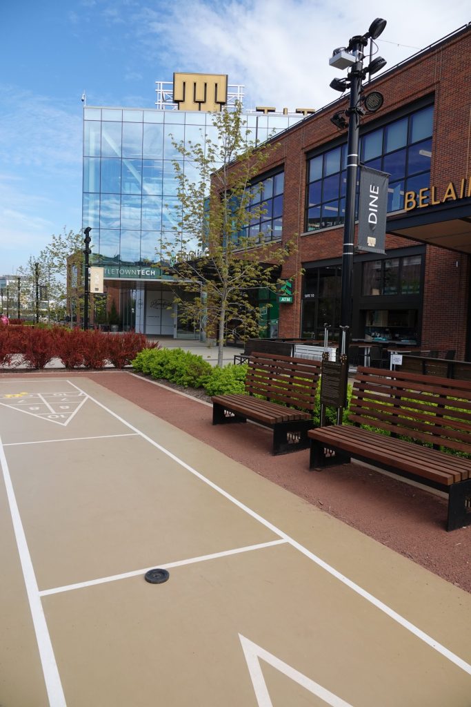Title Town Green Bay Area with outdoor game area, dining, and amenities.