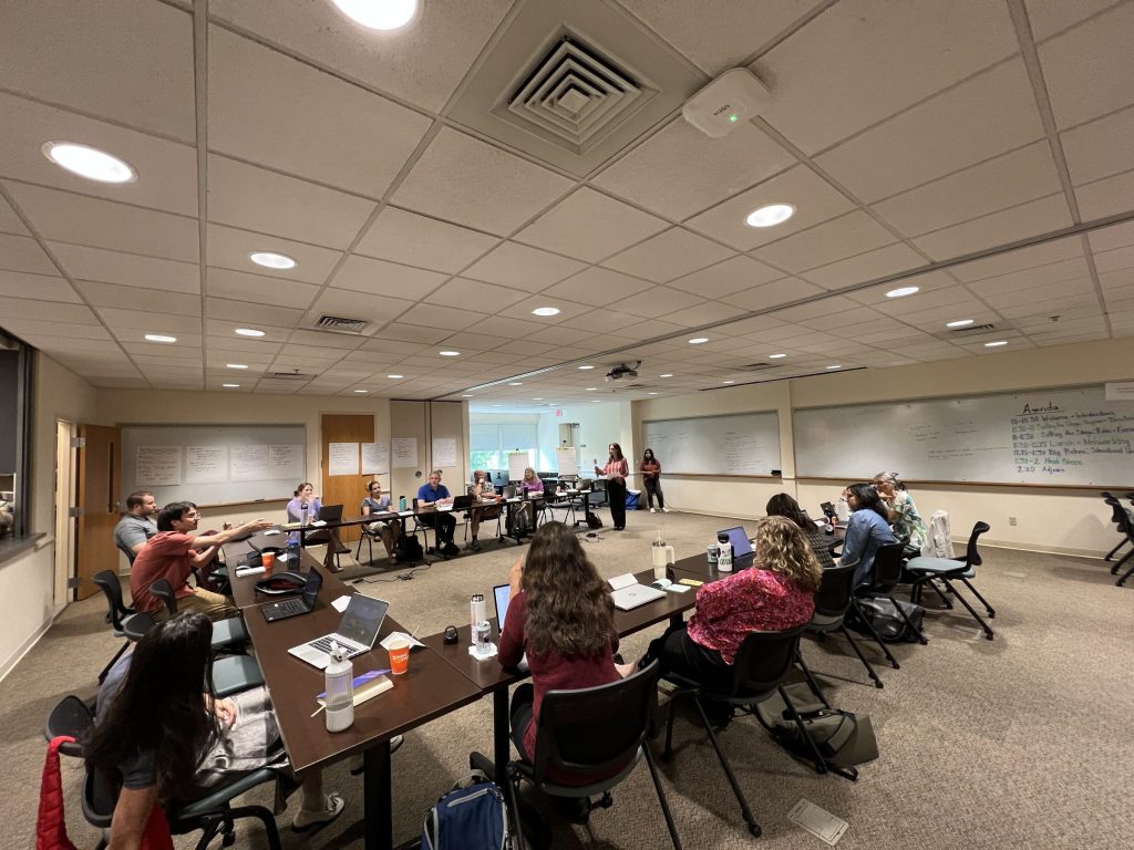 Group meeting with people sitting at tables
