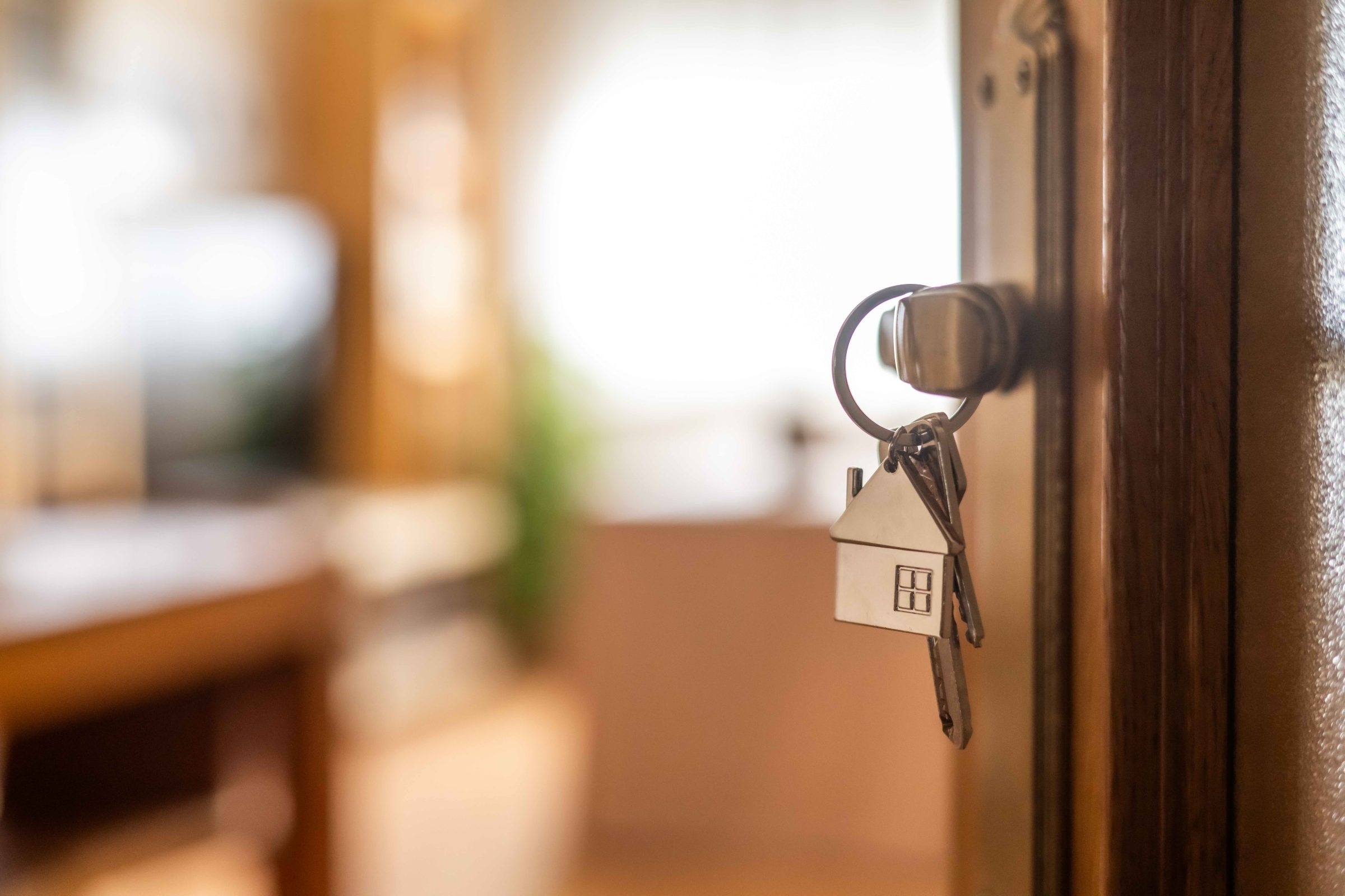 A door with a house shaped keychain
